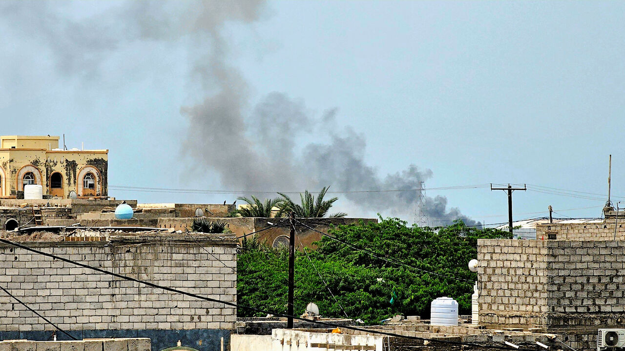 Smoke rises during Houthi missile and drone strikes on the Red Sea port city of Mocha, Yemen, August 9, 2026. Picture taken with a mobile phone. REUTERS/Stringer