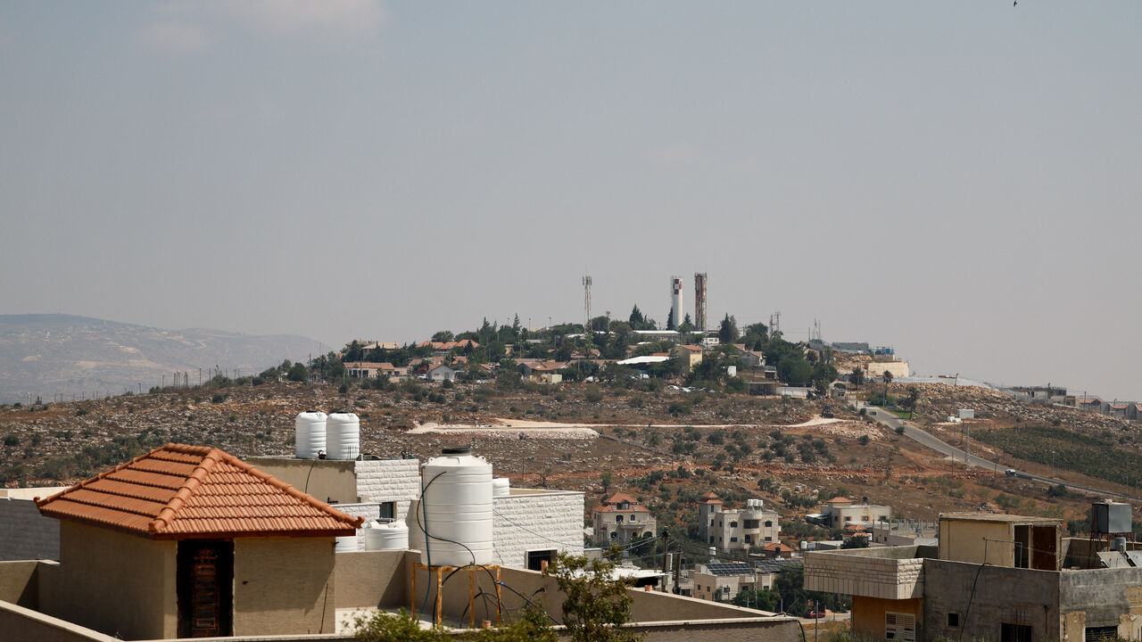 A view of an Israeli settlement, located on a hill, near Qusra village, in the Israeli-occupied West Bank, August 15, 2026. REUTERS/Mohammed Torokman