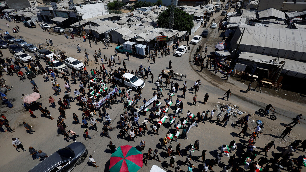 Palestinians attend the funeral of 50 people from three families killed during the war and whose bodies were retrieved from under the rubble recently, in Gaza City, August 20, 2026. REUTERS/Mahmoud Issa