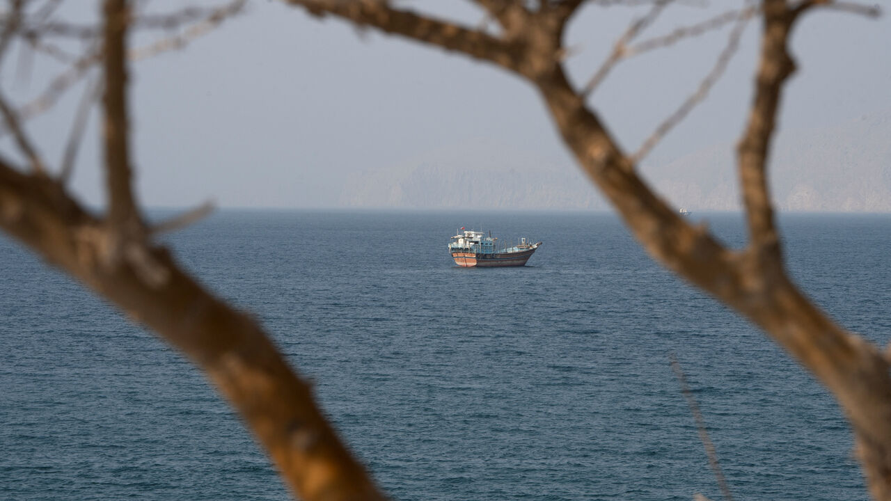 A vessel near the Strait of Hormuz, as seen from Musandam, Oman, August 17, 2026. REUTERS/Stringer
