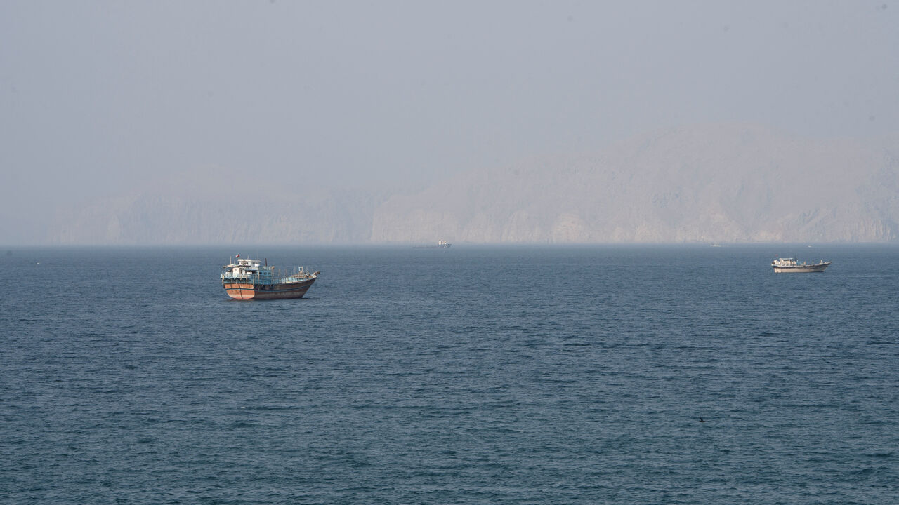 Vessels near the Strait of Hormuz, as seen from Musandam, Oman, August 17, 2026. REUTERS/Stringer