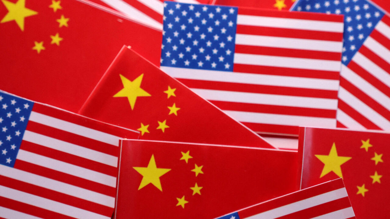 FILE PHOTO: U.S. and Chinese flags are seen in this illustration taken March 20, 2025. REUTERS/Dado Ruvic/Illustration/File Photo