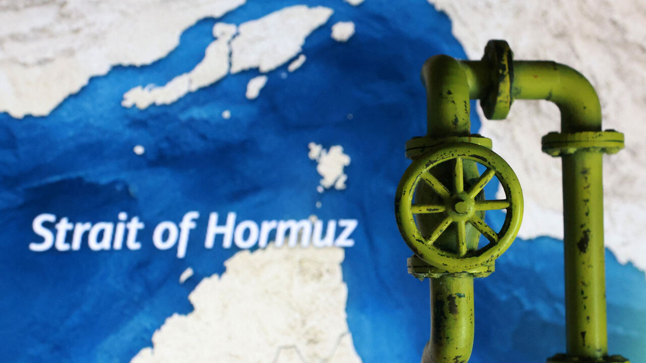 A map showing the Strait of Hormuz and a 3D printed oil pipeline are seen in this illustration taken March 23, 2026. REUTERS/Dado Ruvic/Illustration