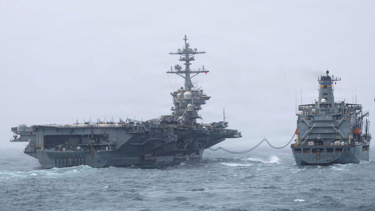 FILE PHOTO: The U.S. Navy Nimitz-class aircraft carrier USS Abraham Lincoln, which is supporting U.S. military operations in the war with Iran, conducts a replenishment-at-sea with fleet replenishment oiler USNS Henry J. Kaiser, August 16, 2026.   U.S. Navy/Handout via REUTERS/ File Photo