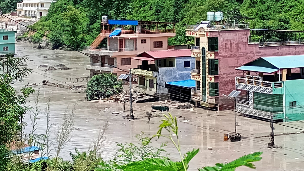 A flooded road following a flash flood in Galchhi in the Dhading district, Nepal, August 26, 2026. REUTERS/Stringer