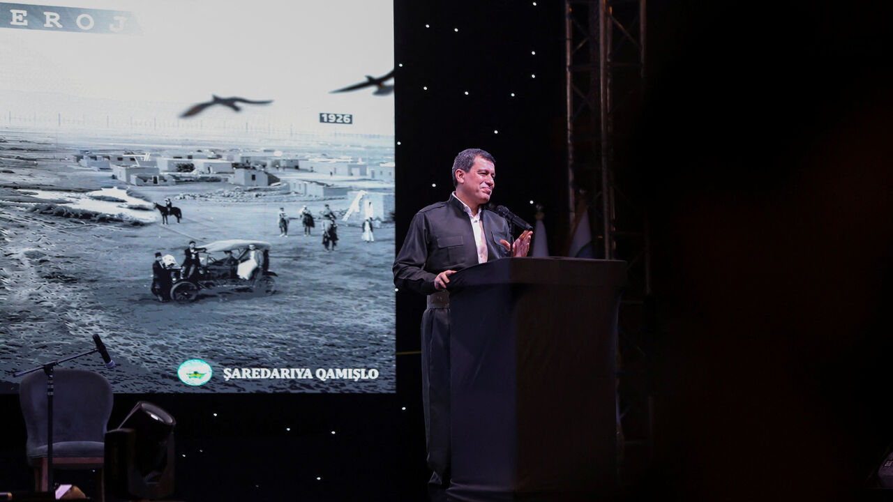 SDF commander Mazloum Abdi delivers a speech during a celebration marking the centenary of the city of Qamishli, Syria, August 20, 2026. REUTERS/Orhan Qereman