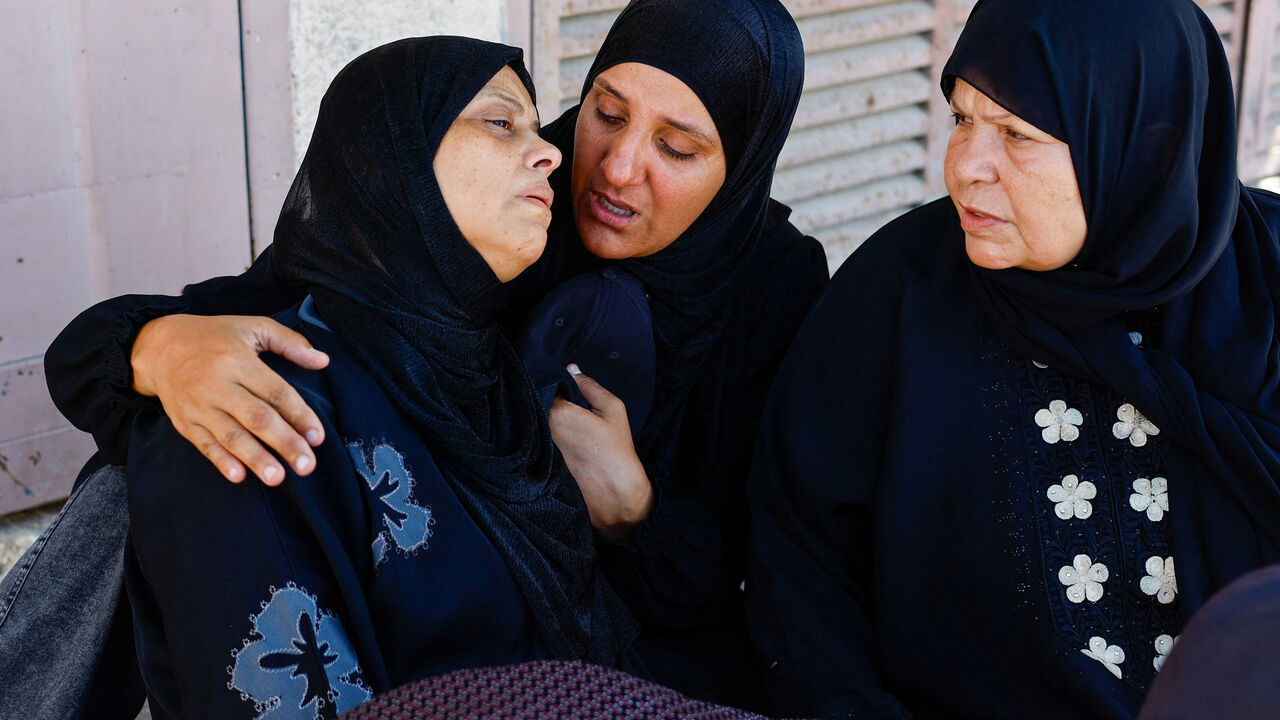 Mother of three-year-old Palestinian child Tayyem Hamdan, who was killed in an Israeli strike according to medics at Al-Aqsa Martyrs Hospital in Deir al-Balah, reacts during his funeral in central Gaza Strip, August 30, 2026. REUTERS/Mahmoud Issa