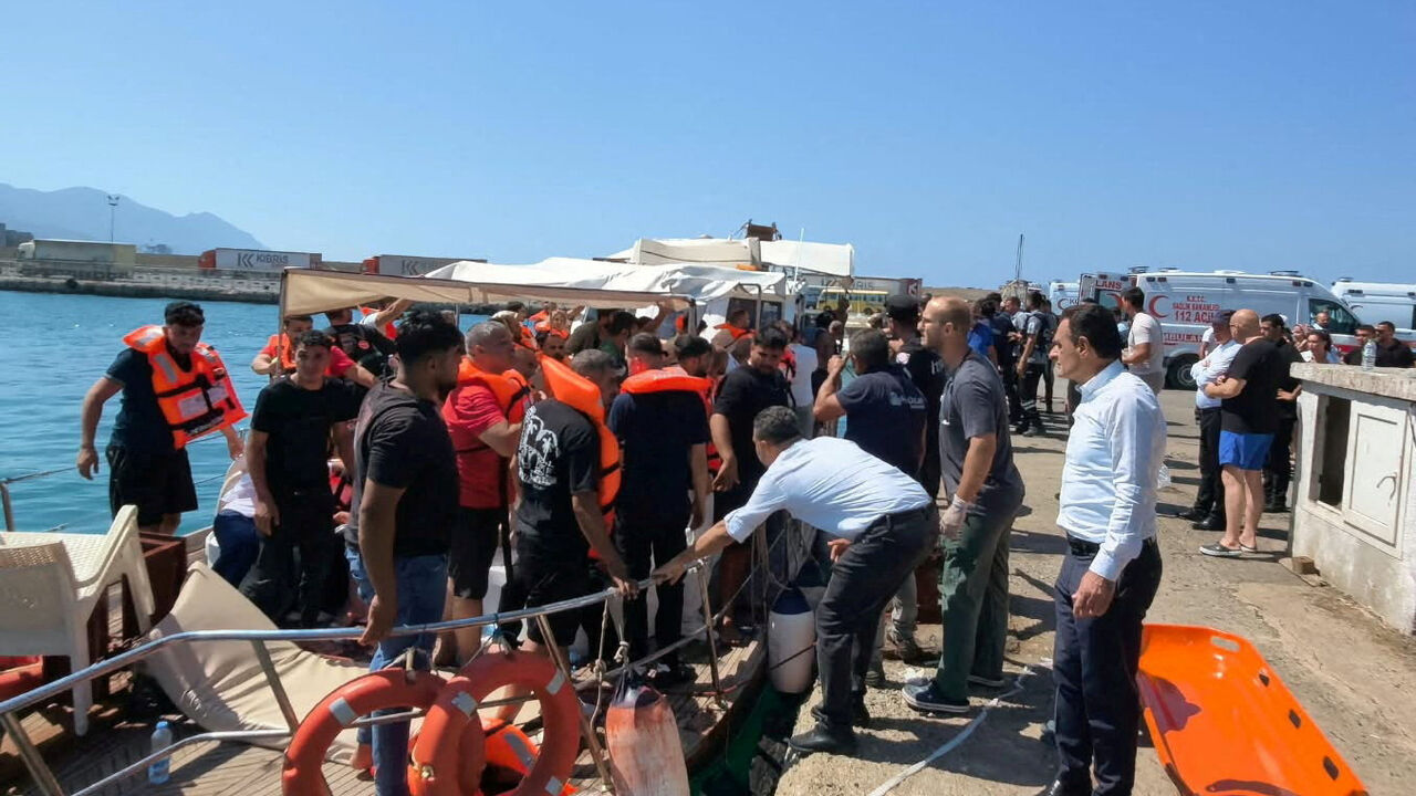 Survivors arrive on shore after being rescued from the sea following a boat capsize off Kyrenia, northern Cyprus, August 30, 2026. REUTERS/Stringer     TPX IMAGES OF THE DAY