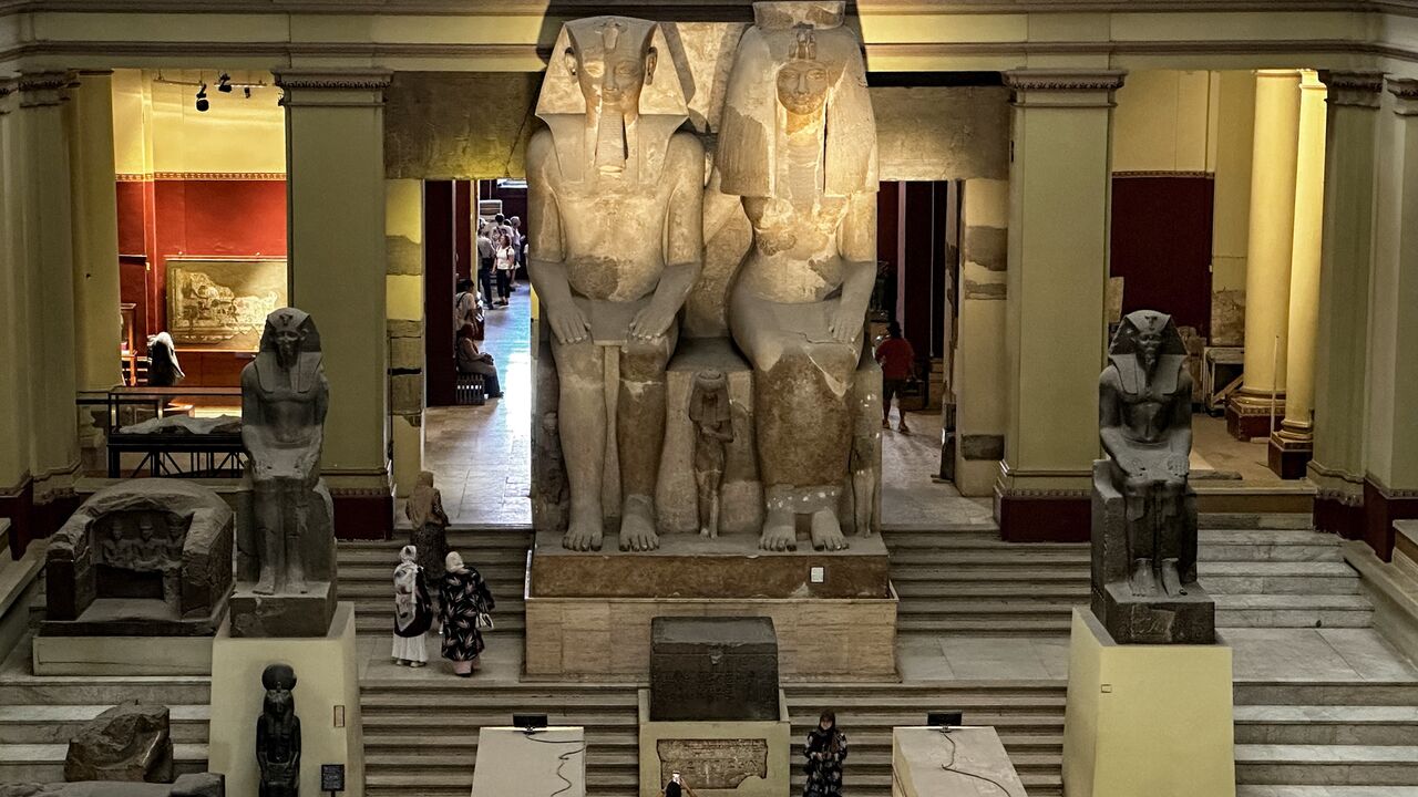 The 26-feet-tall statues of the ancient Egyptian King Amenhotep III (1391-53 BC), father of Amenhotep IV (Akhenaten) and probably grandfather of Tutankhamun, and his consort queen, Tiye, at the Egyptian Museum, Tahrir Square, Cairo, June 11, 2025.