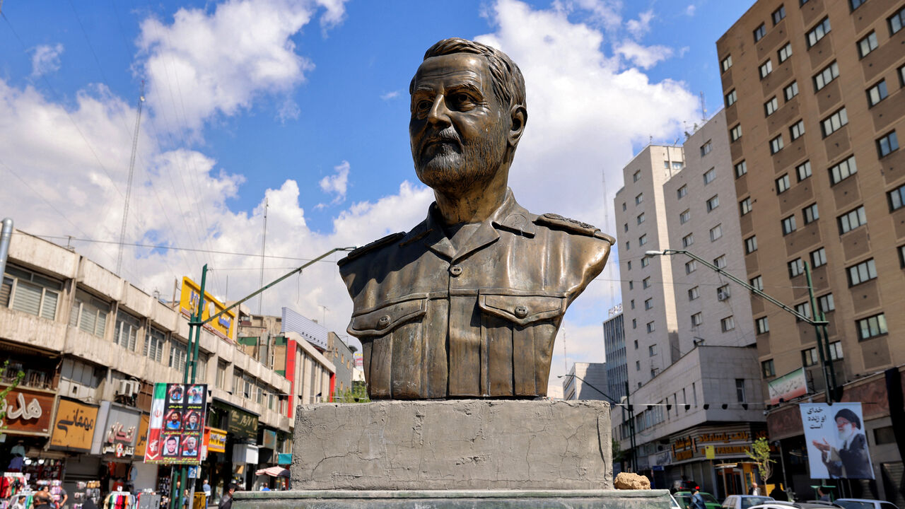 A memorial depicting Qassem Soleimani, the slain commander of the "Quds Force" of Iran's Islamic Revolutionary Guards Corps (IRGC), who was killed by a US airstrike in Iraq in 2020, is pictured at Valiasr Square in Tehran on April 6, 2026. Israeli strikes killed the intelligence chief of Iran's Revolutionary Guards, as the Islamic republic on April 6 defied threats from the US President to devastate civilian infrastructure if it does not reopen the Strait of Hormuz. (Photo by ATTA KENARE / AFP via Getty Ima