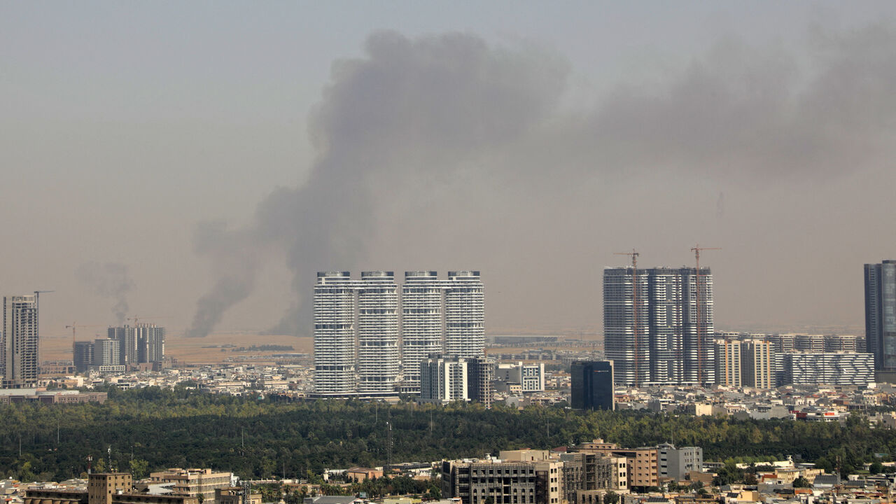 Smoke rises after explosions were heard and air defences activated near the airport in Erbil, on July 24, 2026.  