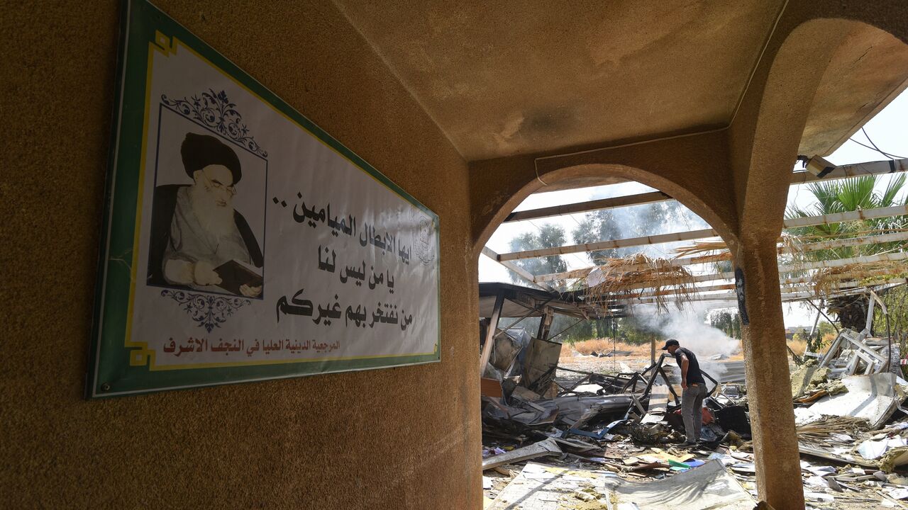 A man inspects the damage at the site of a strike in Bartalla, in the northern Iraq's Nineveh province, after US-Saudi attacks on militias, July 29, 2026.