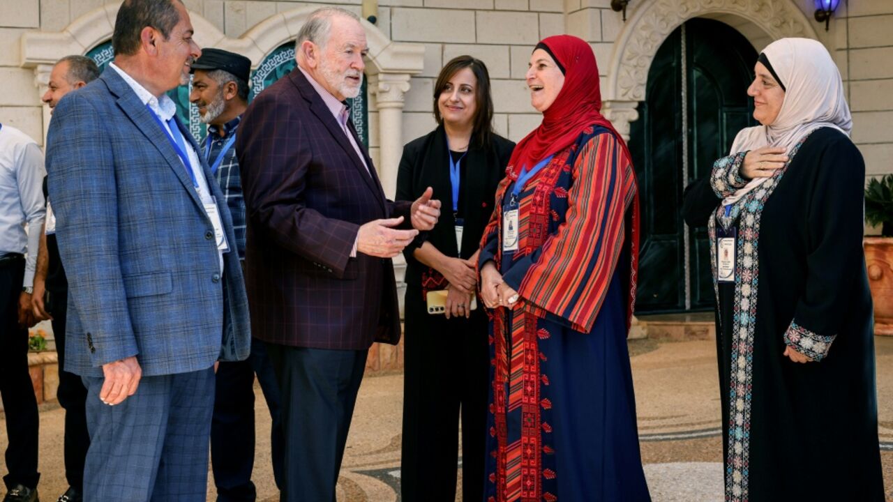 US Ambassador to Israel Mike Huckabee is greeted by members of the local municipality as he arrives to visit the home of a Palestinian-American in the Israeli-occupied West Bank town of Turmus Ayya