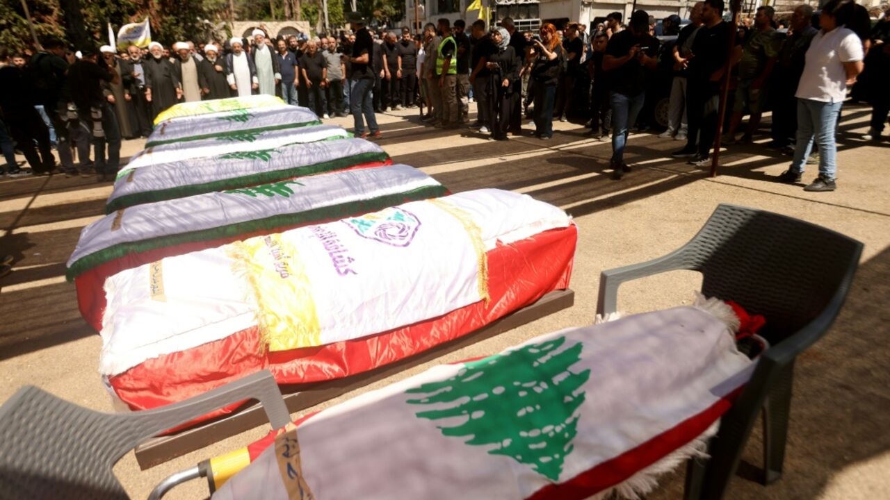 Hundreds gather in Kfar Rumman, Lebanon on Tuesday to mourn people killed in an Israeli airstrike a day prior