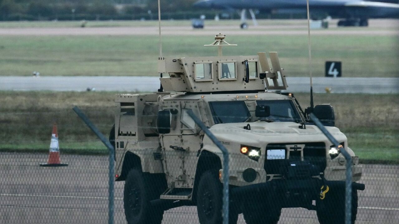An armoured vehicle patrols RAF Fairford base, southwest England