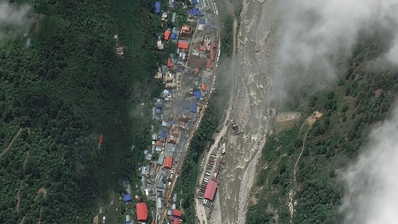 A satellite image shows buildings and roads before flash floods and a mudslide, in Timure, Nepal, July 1, 2026. Vantor/Handout via REUTERS