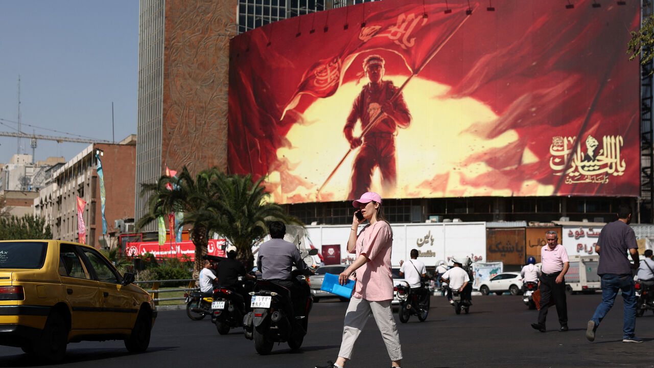 A woman walks on a street in Tehran, Iran, September 2, 2026. Majid Asgaripour/WANA (West Asia News Agency) via REUTERS