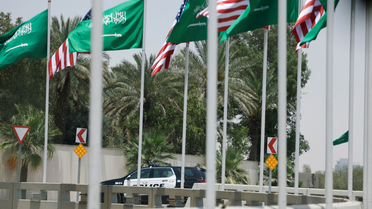 U.S. and Saudi flags flutter along a highway of Riyadh, as pictured through the glass of a car, ahead of the arrival of U.S. President Donald Trump to Riyadh, Saudi Arabia May 12, 2025. REUTERS/Hamad I Mohammed