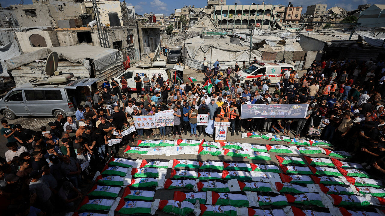 FILE PHOTO: Palestinians attend the mass funeral for members of the Irahem, Malaka, Qanbour, Balawi and Dahdouh families, who were killed in an Israeli strike in 2023 and whose remains were recovered from beneath the rubble, according to Gaza’s Civil Defense, in Gaza City, September 6, 2026. REUTERS/Dawoud Abu Alkas/File Photo