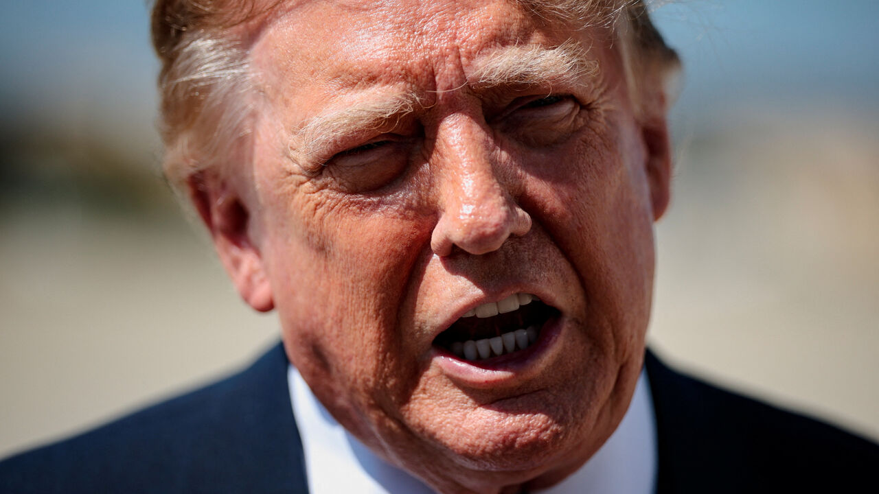U.S. President Donald Trump speaks to the media before boarding Air Force One for a trip to the Republican National Midterm Convention, at Joint Base Andrews, Maryland, U.S. September 9, 2026. REUTERS/Evan Vucci