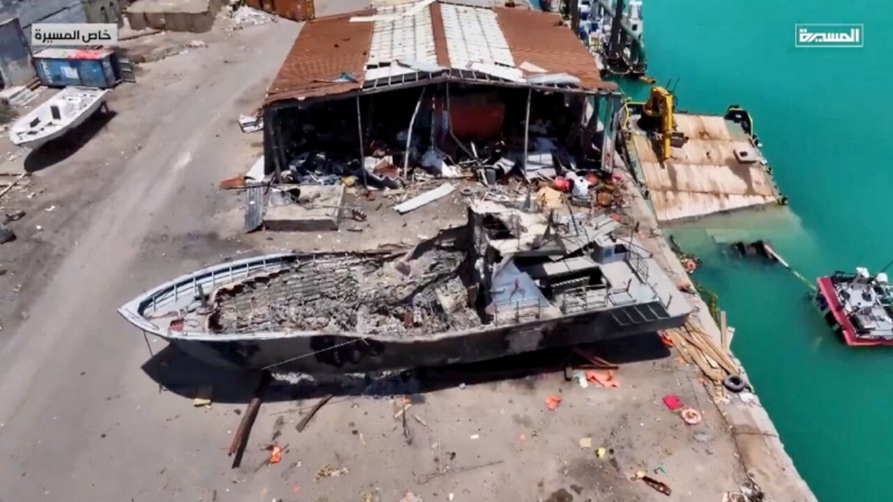 An aerial view shows a damaged boat in Mocha