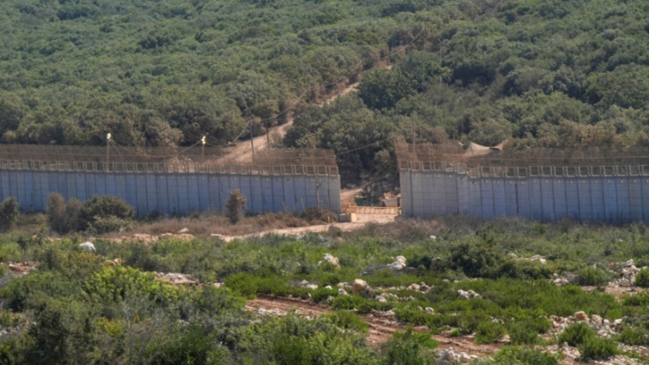 A gate and access road built by Israeli forces in a section of the border barrier separating Lebanon and Israel, seen from Lebanon