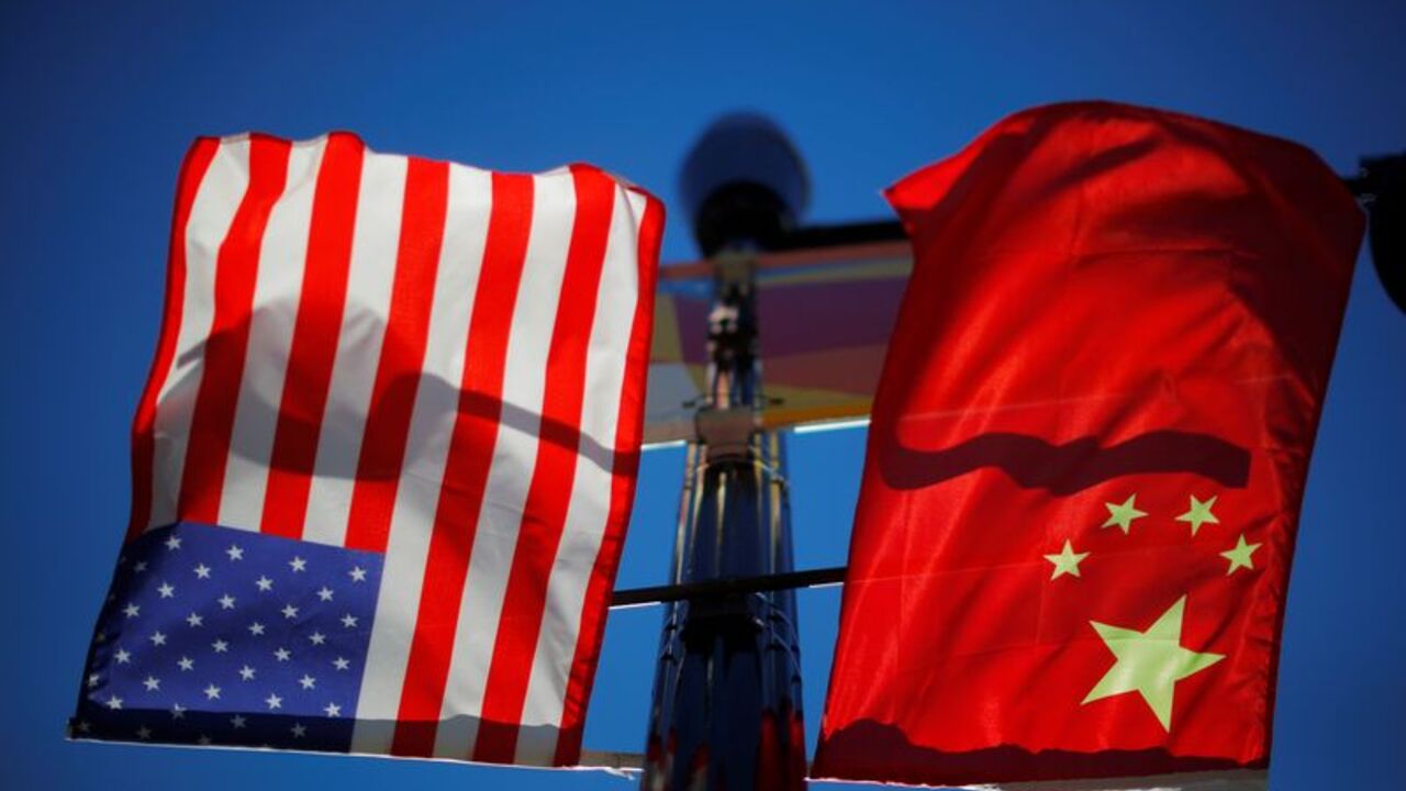The flags of the United States and China fly in Boston