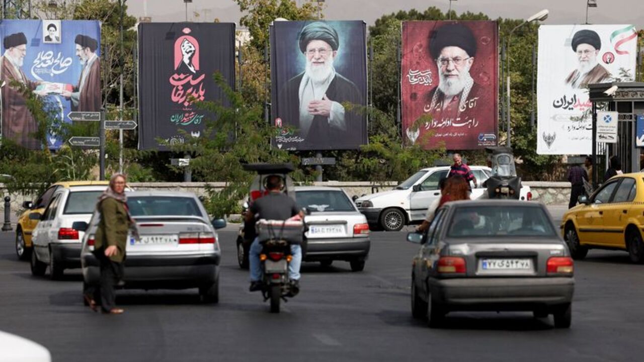 Banners with pictures of the late Supreme Leader of Iran, Ayatollah Ali Khamenei, are displayed on a street in Tehran