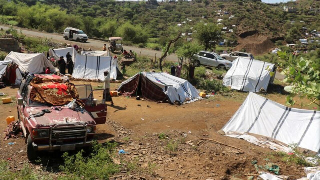 Displaced Yemenis take shelter at a makeshift camp in Taiz province