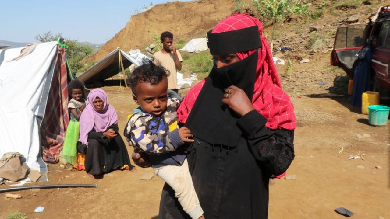 Displaced Yemenis take shelter at a makeshift camp in Taiz province