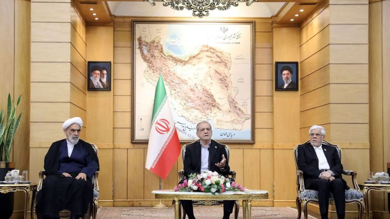 Iranian President Masoud Pezeshkian speaks before departing for New York, at Mehrabad Airport in Tehran