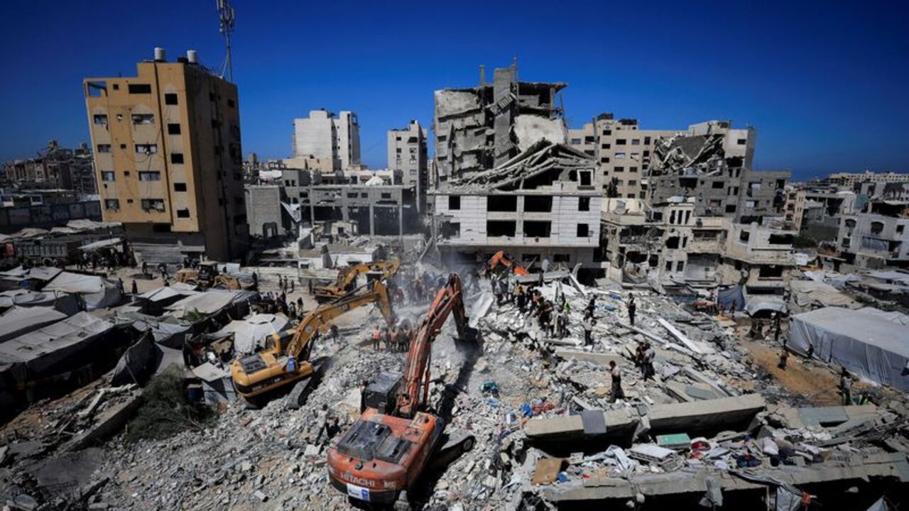Rescue operations at the site of a war-damaged building collapse in Gaza City