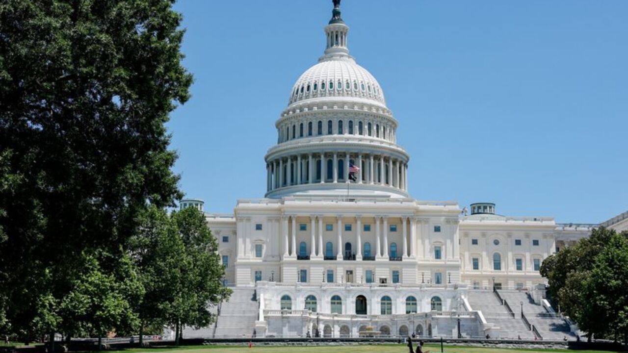 A person maintains the grounds in front of the U.S. Capitol building in Washington