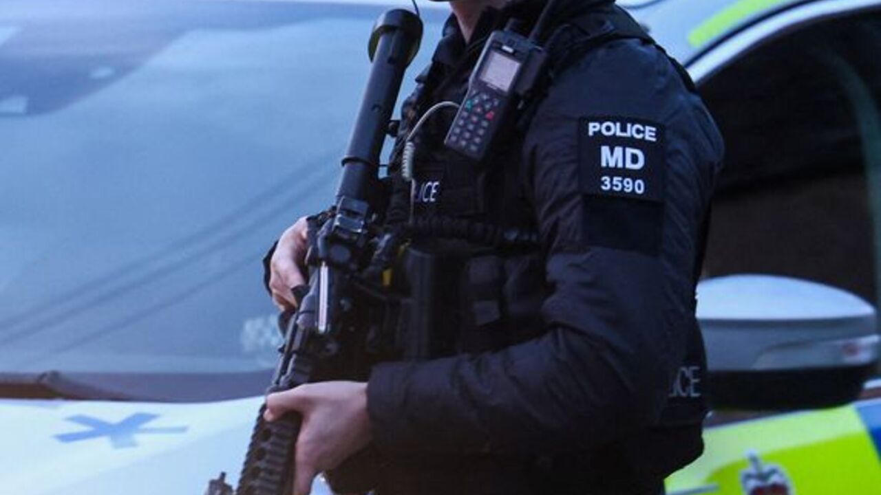 A police officer blocks a road near the RAF Fairford airbase, in Fairford