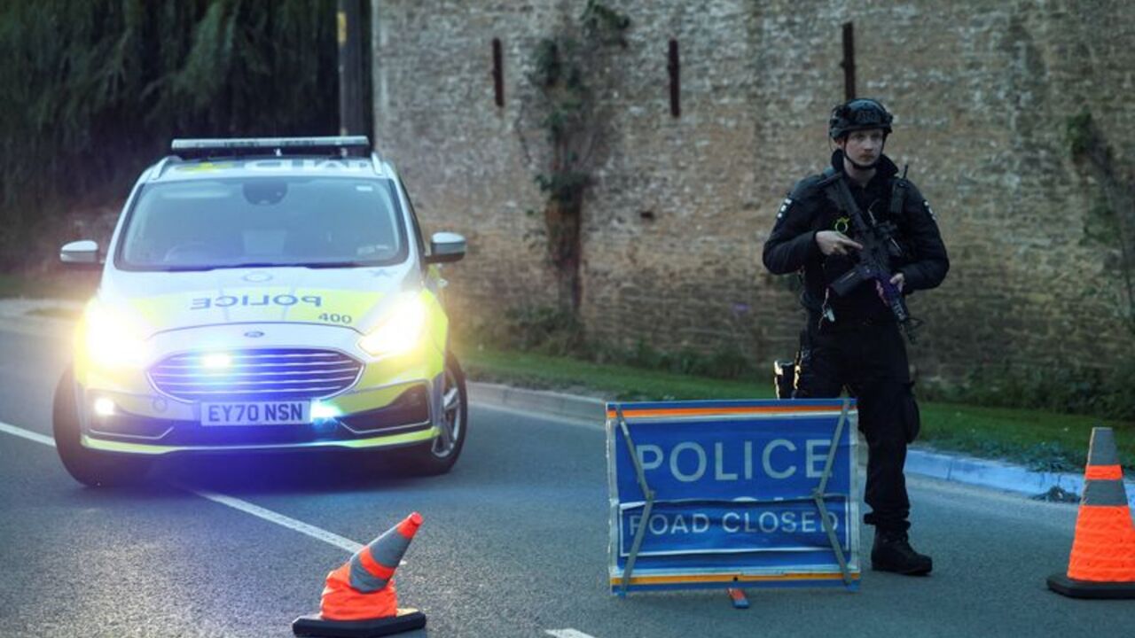 A police officer blocks a road near the RAF Fairford airbase, in Fairford