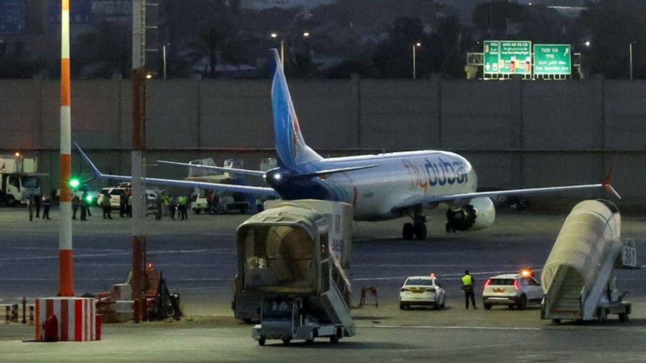 Passengers from a FlyDubai flight to Israel from United Arab Emirates that was diverted to Saudi Arabia after an emergency signal arrive at Ben Gurion International Airport