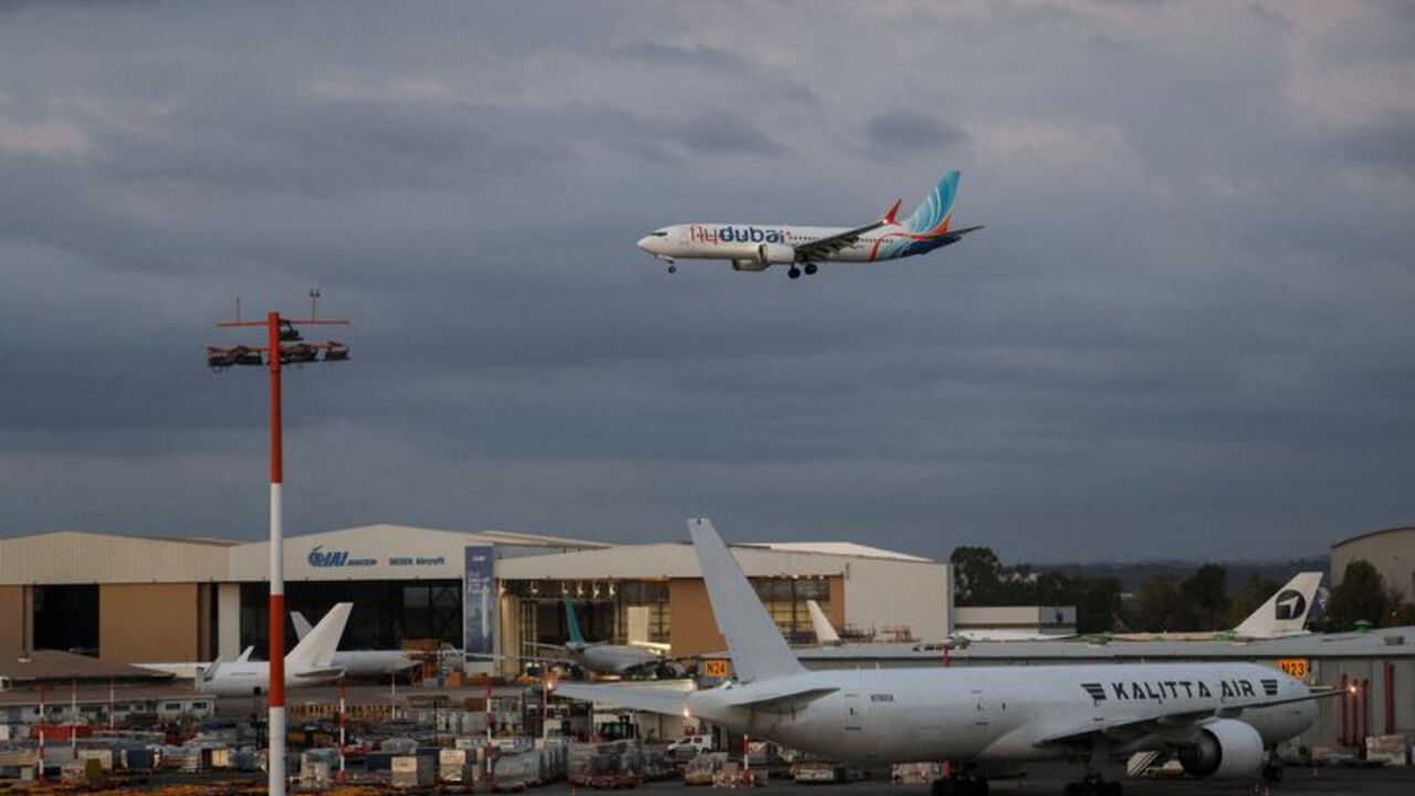 Passengers from a FlyDubai flight to Israel from United Arab Emirates that was diverted to Saudi Arabia after an emergency signal arrive at Ben Gurion International Airport