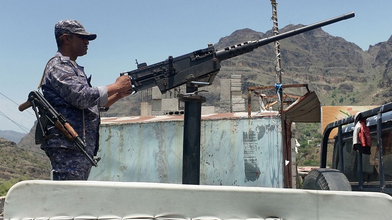 A member of the Saudi-backed Yemeni government forces, including National Army and Taiz Axis forces, mans a turret mounted on the back of a pickup truck at a checkpoint along the Kadha frontline west of Taiz in western Yemen on Sept. 13, 2026. 