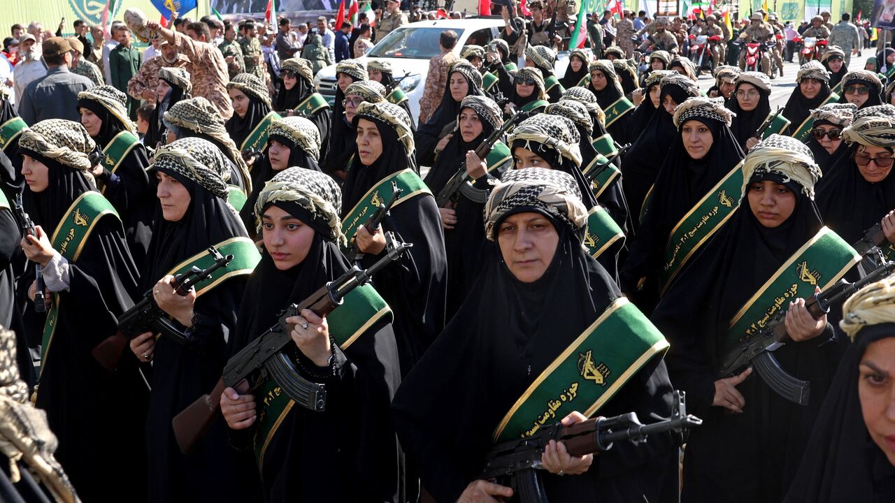 Members of Iran's Basij paramilitary force march with riffles during a military rally named Jan-Fada in Tehran, Sept. 18, 2026.