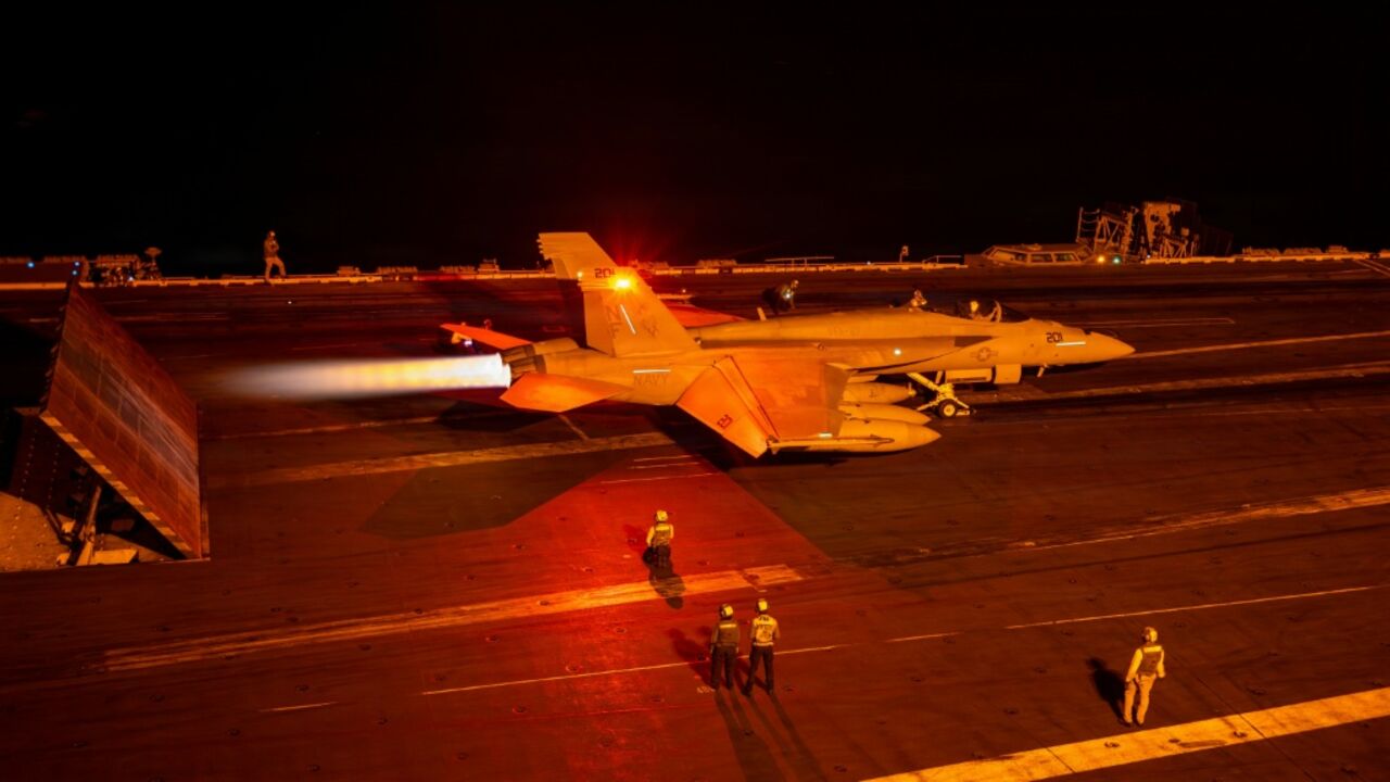 A photo released by the US Navy shows an F/A-18 Super Hornet launching from the flight deck of the USS George Washington as it operates in the Middle East on September 9, 2026