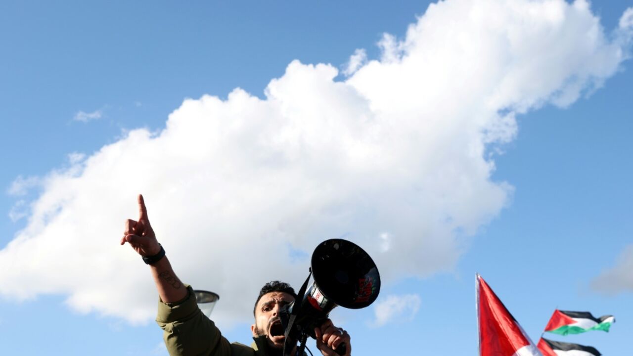 An activist with a megaphone at a 'United4Palestine' rally in Berlin on October 10, 2026
