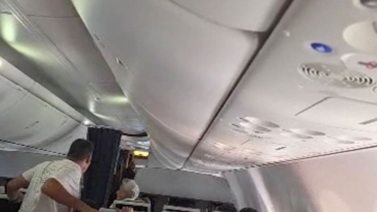 Flydubai passengers react and check after realising there is commotion in the cockpit