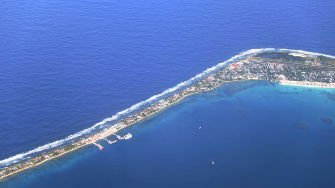 Aerial view of Funafuti, Tuvalu’s most populous island, showing the port and main town of Fongafale