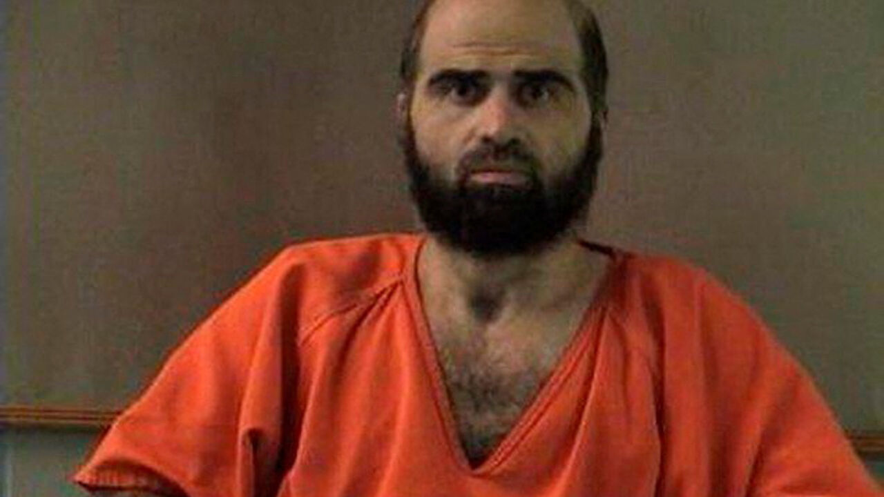 FILE PHOTO: Handout photo of Nidal Hasan, charged with killing 13 people and wounding 31 in a November 2009 shooting spree at Fort Hood.