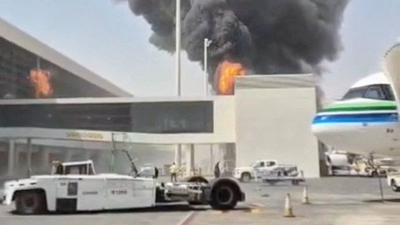Smoke and flames rise from King Khalid Airport, after Yemen's Iran-backed Houthis said they attacked the airport, in Riyadh