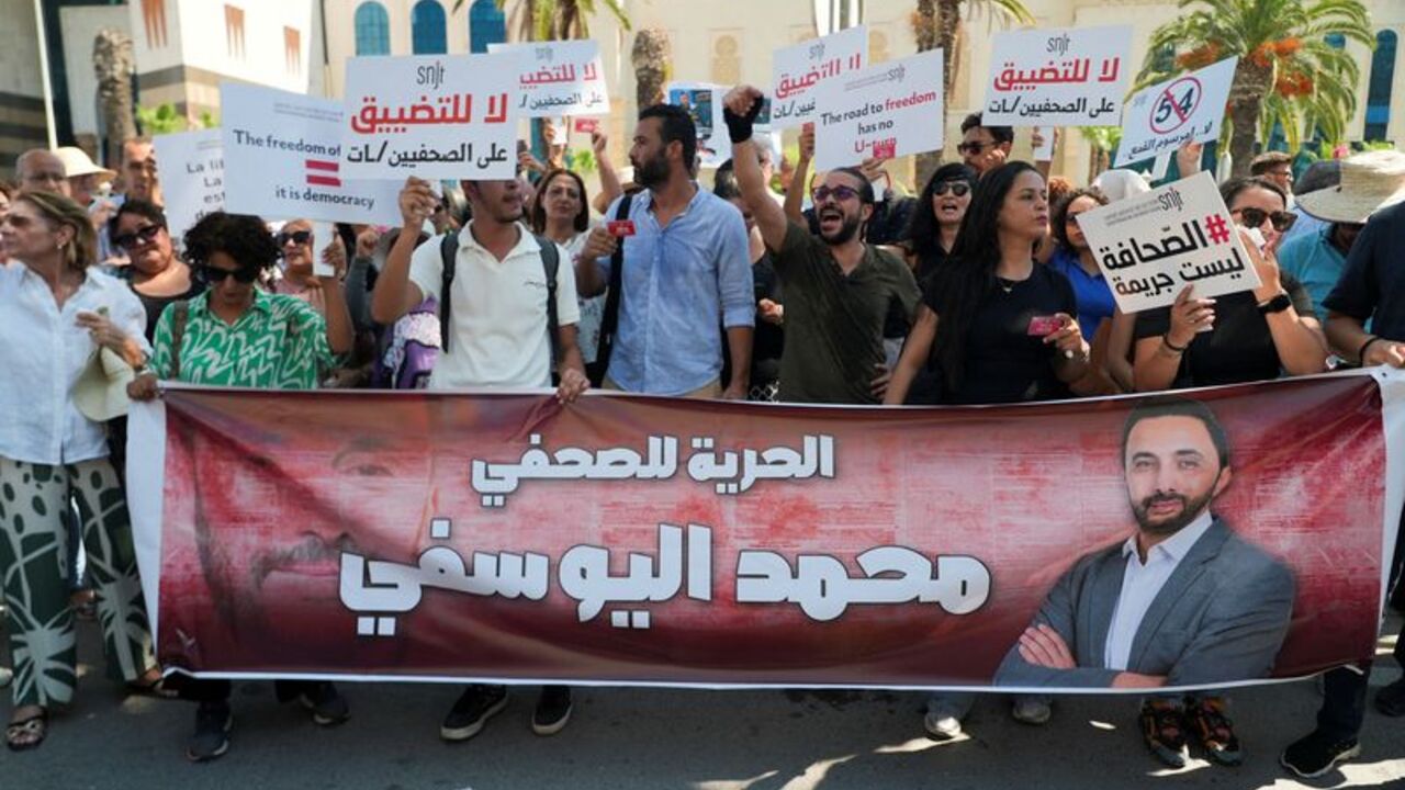 Tunisian journalists participate in a rally called by the Tunisia journalists' union to demand the release of journalist Mohamed Yousfi, in Tunis