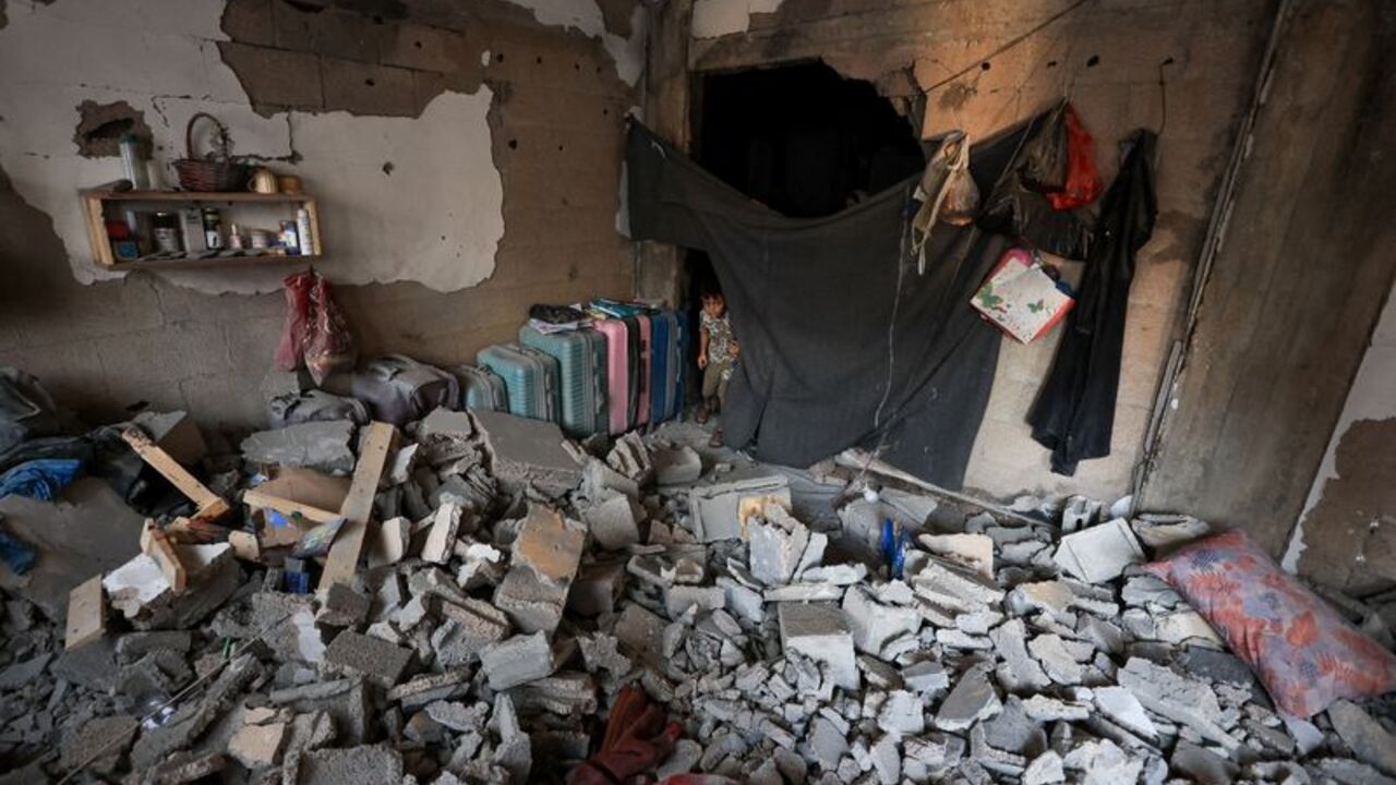 Aftermath of Israeli strike on an apartment, in Gaza City