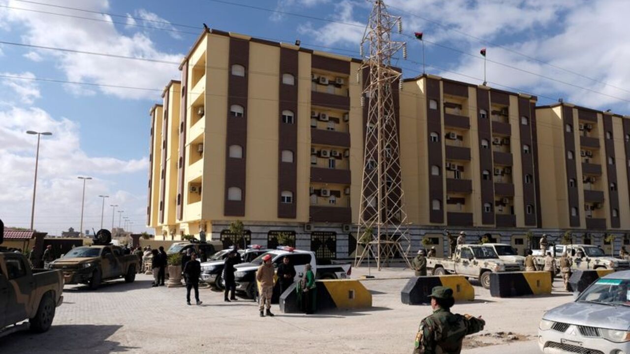 Security forces stand guard outside the Parliament building in Tobruk, Libya