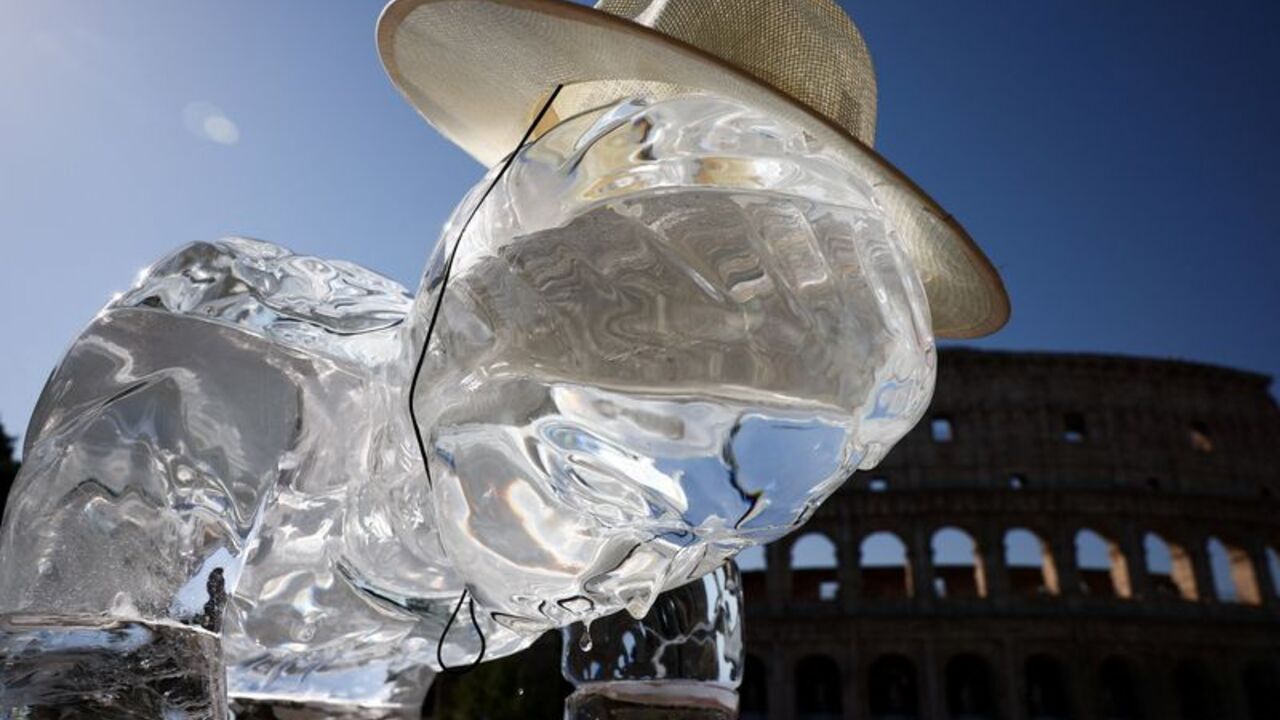 Greenpeace activists place ice statues near the Colosseum in Rome