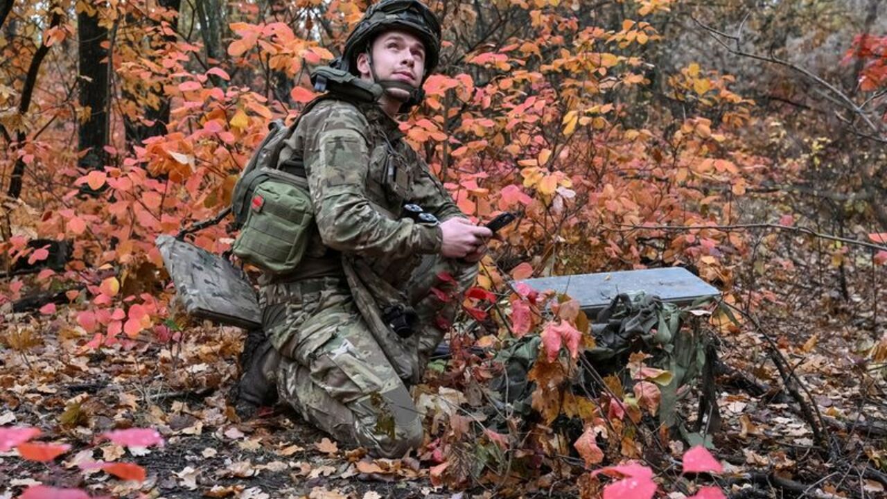 FILE PHOTO: An artilleryman of the Special Rifle Police Battalion sets up Starlink satellite internet system near the frontline in Donetsk region